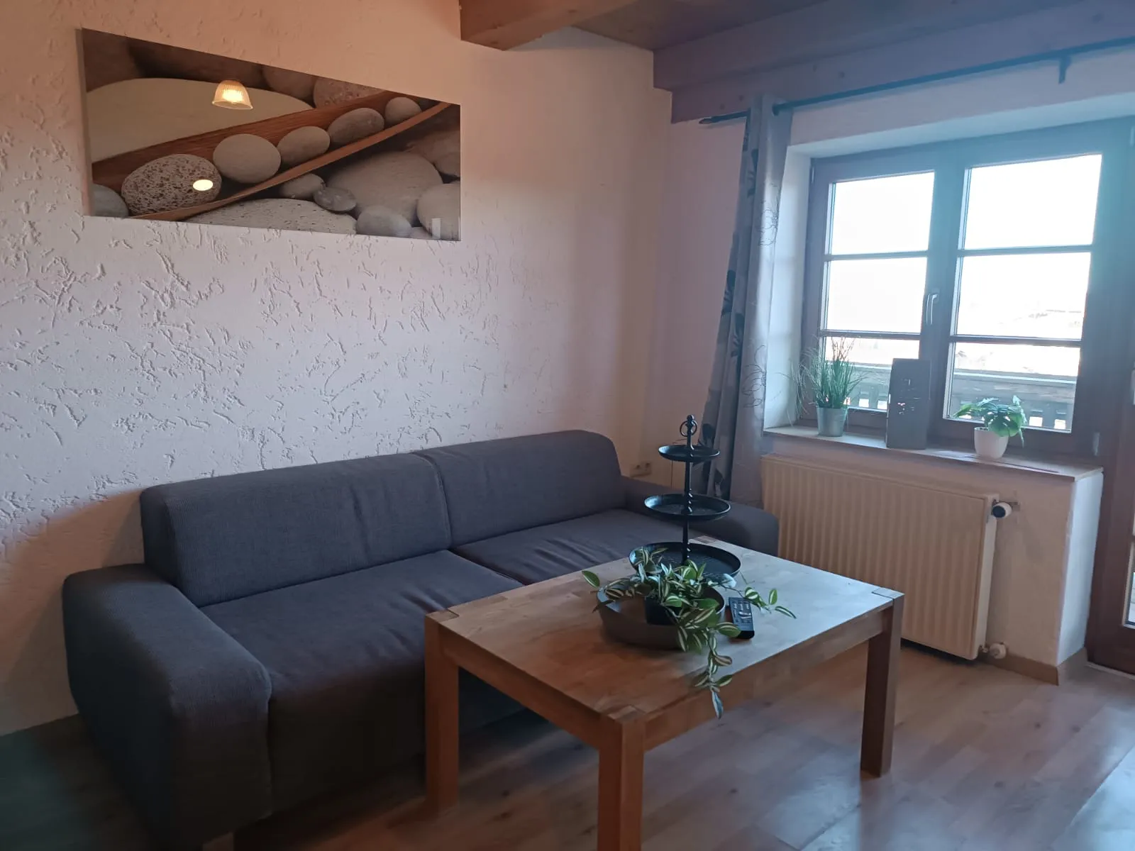 Ferienwohnung fesche Leonie - Wohnzimmer mit Sofa