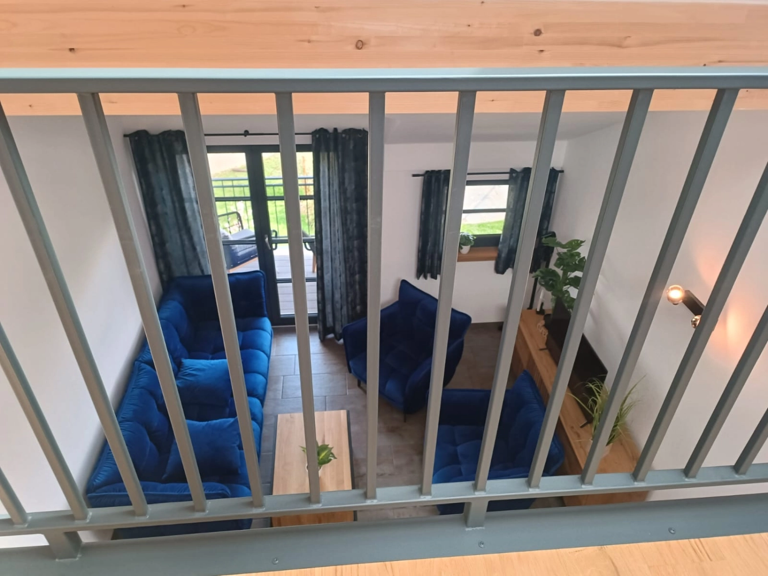 Ferienwohnung Delux - Blick von der Galerie ins Wohnzimmer